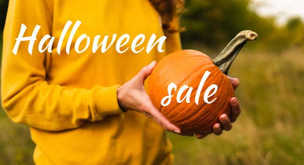 Halloween Sale Young Woman Yellow Sweatshirt Holds Orange Pumpkin Banner — Stock Photo, Image