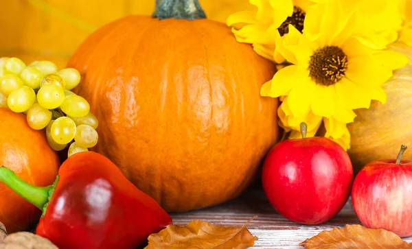 Holiday Thanksgiving. Seasonal vegetables and fruits on a wooden table. Close-up. Selective focus.