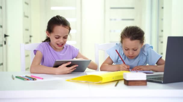 Two Children Homework Home One Tablet Other Writes Homework High — Video Stock