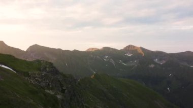 Aerial Drone View Flight over Mountain at sunset. High quality 4k footage