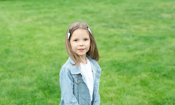 Small Beautiful Caucasian Girl Denim Jacket White Shirt Stands Background — Stockfoto
