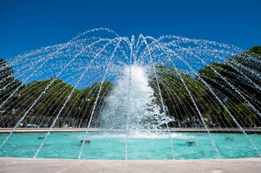 Fountain close-up in summer in Italy, Bibione with blue sky clipart