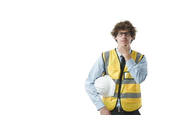 Jonge Blanke Ingenieur Die Zijn Kin Met Een Merkwaardige Uitdrukking — Stockfoto