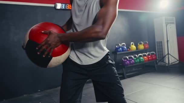 Hip Level Shot Black Man Athlete Exercising Swing Weight Ball — Stockvideo