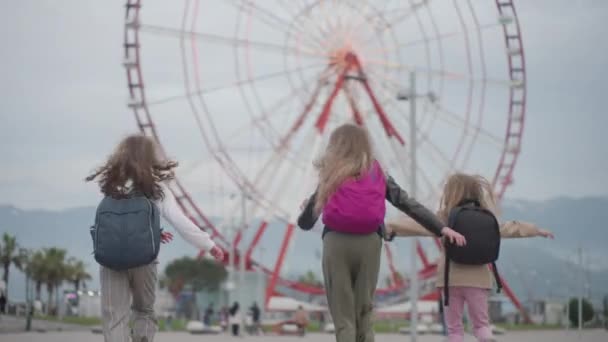 Happy School Children Bags Run Giant Wheel Raise Hands Imitating — Vídeos de Stock