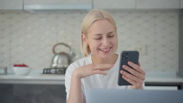 Young Smiling Joyful Blonde Woman Waves Goodbye Finishes Video Conference — Stockvideo