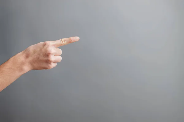 pointing finger with dark background