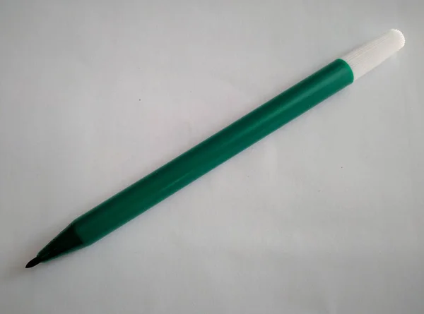 green marker on white background