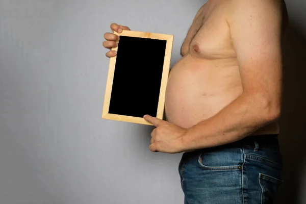 Overweight Shirtless Caucasian Man Standing Sideways Holding Blackboard — Foto de Stock