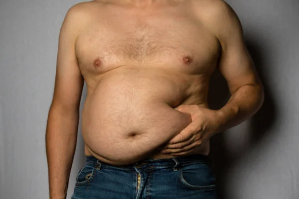 Overweight Shirtless Caucasian Man Standing Facing Front Holding His Fat — стоковое фото