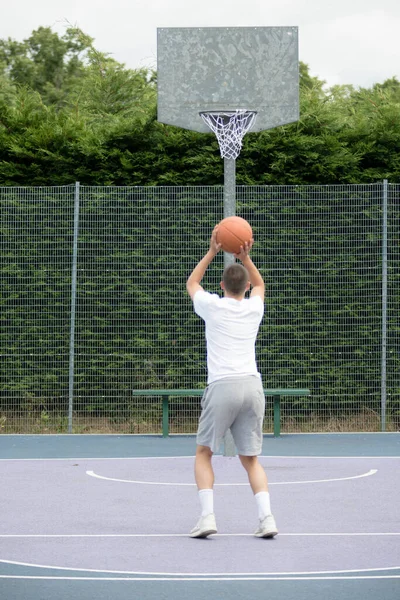 Nineteen Year Old Teenage Boy Shooting Hoop Basketball Court Public — 스톡 사진