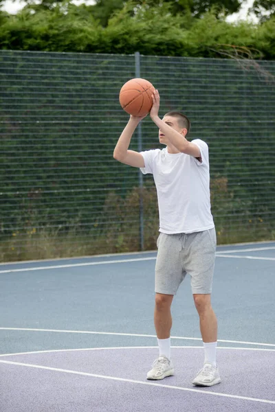 Nineteen Year Old Teenage Boy Shooting Hoop Basketball Court Public — 스톡 사진