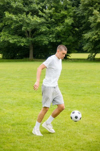 Nineteen Year Old Teenage Boy Playing Football Public Park — Fotografia de Stock