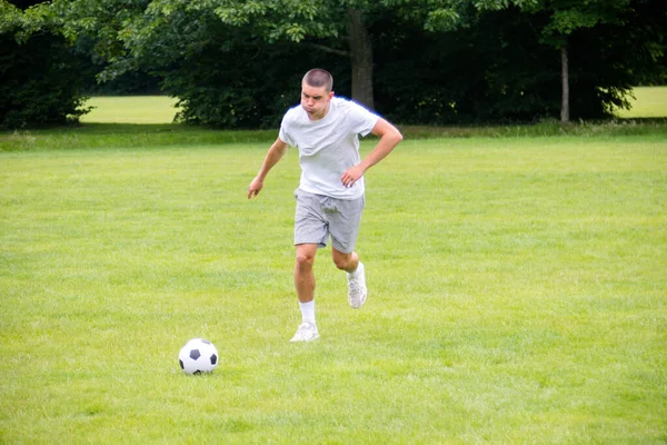 Nineteen Year Old Teenage Boy Playing Football Public Park — Fotografia de Stock