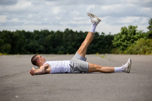 Nineteen Year Old Teenage Boy Doing Leg Raises Public Park — Stock Fotó