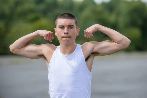 Nineteen Year Old Teenage Boy Flexing His Biceps Public Park — Photo