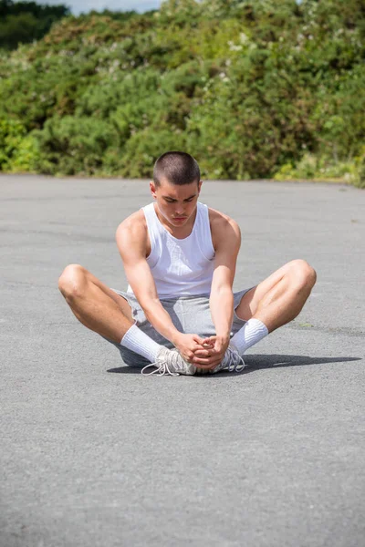 Nineteen Year Old Teenage Boy Stretching Public Park — Stock fotografie