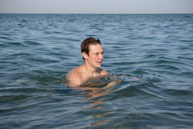 A 17 Year Old Teenage Boy Swimming In The Sea
