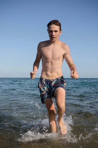 Year Old Teenage Boy Walking Out Sea — Foto de Stock