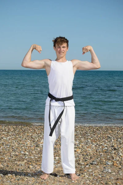 Year Old Teenage Black Belt Flexing His Muscles Beach — Stock Photo, Image