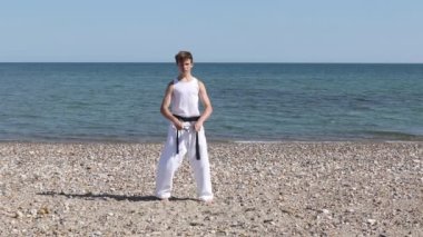 Teenage Boy Doing Karate on A Beach