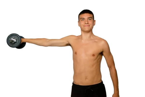 19岁的少年赤手空拳 提起哑铃 — 图库照片