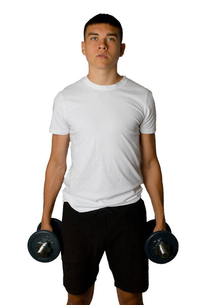 19 year old teenage boy holding dumbbells