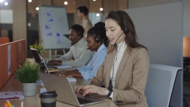 Call center. Service female phone operator talks with client on sale hotline. Busy seller at agency office close-up. Helpful customer service support. — 비디오