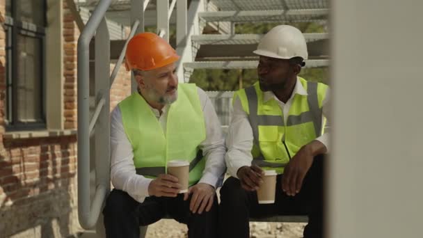 Group Architects Working Uniform Drinking Coffee Talking While Sitting Metal — Stock Video