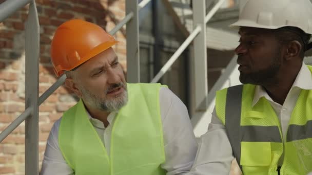 Portrait Two Multiethnic Employees Protective Uniform Taking Break Work Drinking — Stockvideo