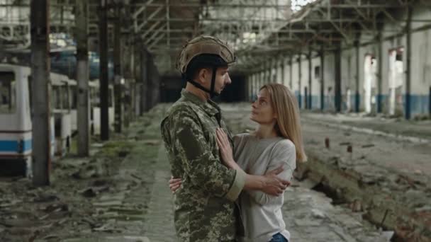 Portrait Male Soldier Beloved Woman Looking Camera While Standing Hugs — 图库视频影像