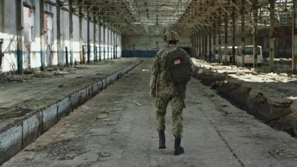 Back View Strong Man Wearing Protective Helmet Military Uniform Walking — Video Stock