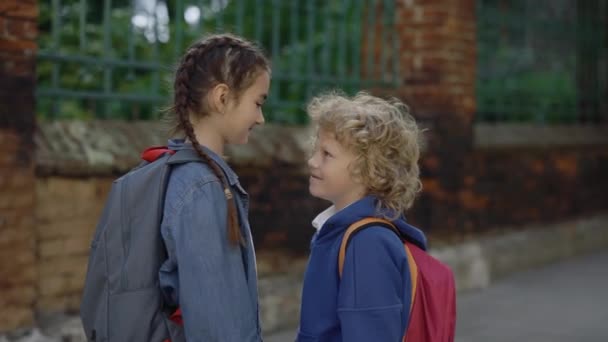 Schoolgirl Hugs Her Little Brother Smilling Street First Love Little — Vídeo de Stock