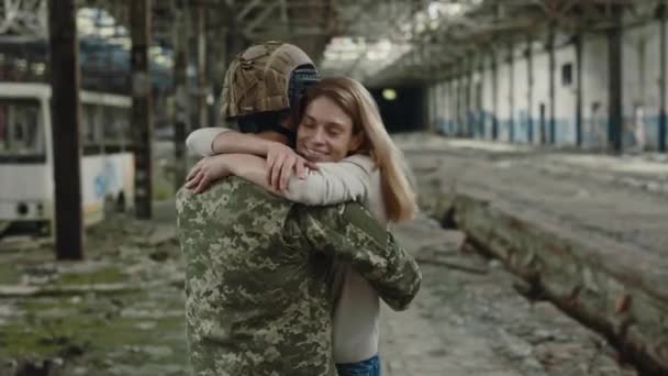 Caucasian Serviceman Embracing Wife Long Separation Abandoned Factory Background Brave — Αρχείο Βίντεο