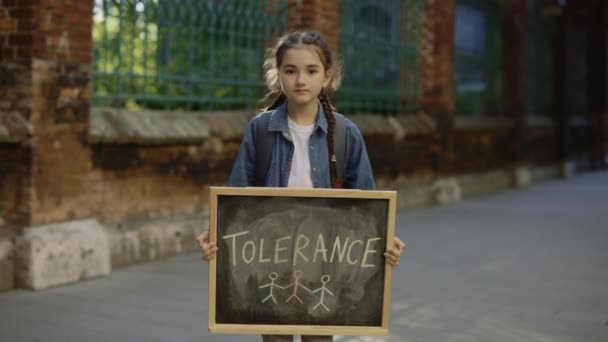 Little Girl Holding Board Inscription Message Text Tolerance Outdoor Blurred — Stockvideo