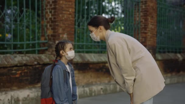 Mother Daughter Wearing Surgery Masks Look Each Other Hug Street — Vídeo de Stock