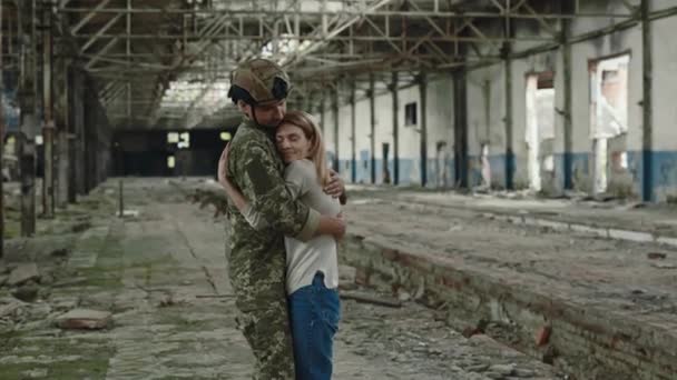 Loving Wife Hugging Strong Husband Soldier Uniform While Standing Together — Video Stock