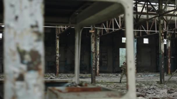 Military Man Devastating Weapon Walking Manufacturing Place While Checking Enemy — Video Stock