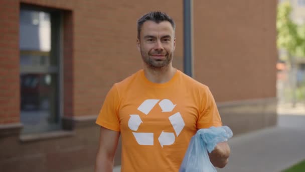 Portrait Male Volunteer Standing Holding Garbage Bag Sorted Garbage Looking — Video Stock
