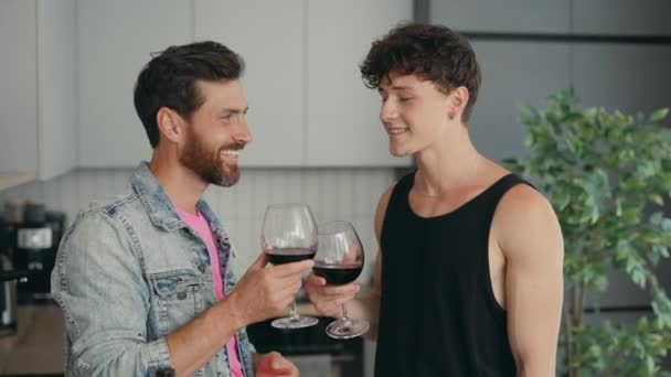 Lgbt Couple Standing New Apartment Drinking Wine Glasses Feeling Happy — Stockvideo