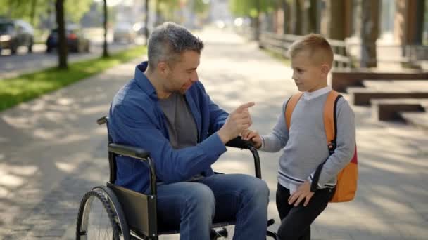 Disabled Father Tells His Son Story Fixing His Backpack School — Stock videók