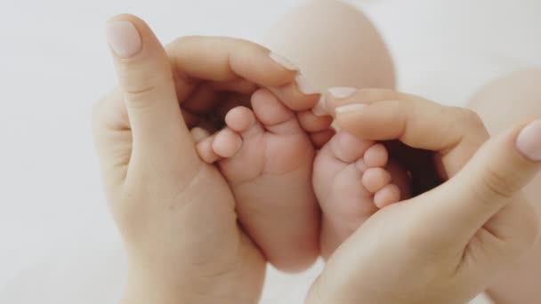 Caring Mom Holds Baby Feet Her Hands Forming Heart Shape — 图库视频影像