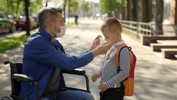 Disabled Father Mask Sitting Wheel Chair Wearing Mask His Son — Videoclip de stoc