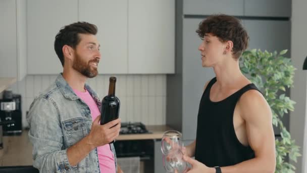 Lgbt Gays Couple Standing Home One Partner Holding Bottle Wine — Stockvideo