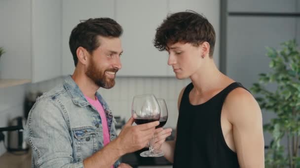 Lgbt Couple Standing New Apartment Drinking Wine Glasses Feeling Happy — Vídeo de stock