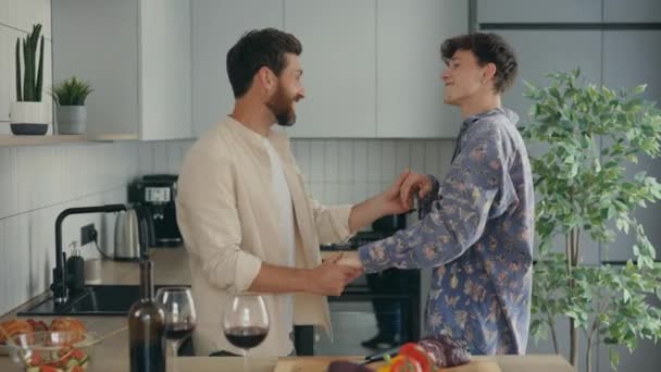 Lgbt Men Couple Dancing Cooking Having Fun New Apartment Together — Stockvideo