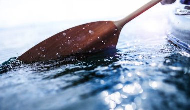 oars splashing in fresh water with energy clipart