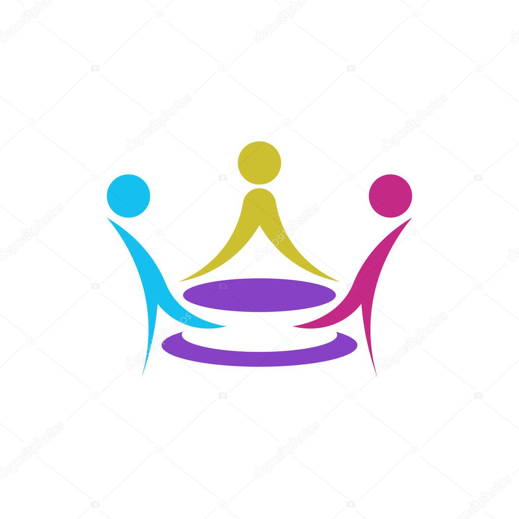Three people at one table, in a colorful logo shaped like a king's crown.