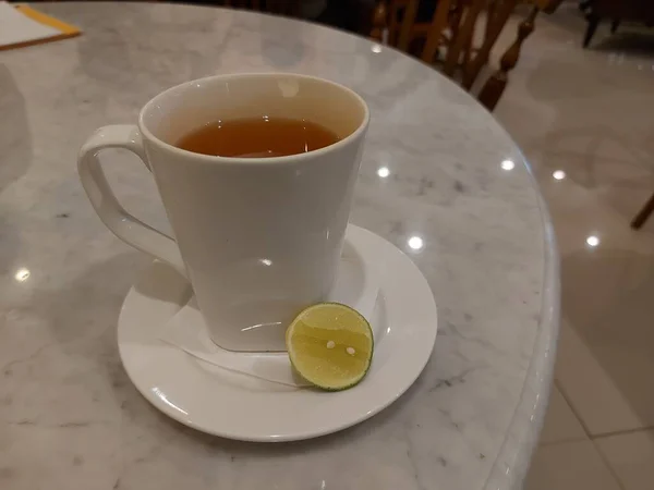 Hot Lime Green Lemon Tea Served White Porcelain Mug Sweet — Stock Photo, Image