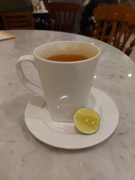 Hot Lime Green Lemon Tea Served White Porcelain Mug Sweet — Stock Photo, Image